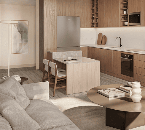 Cocina moderna con barra blanca y banquetas de madera, muebles en tono claro y electrodomésticos integrados.