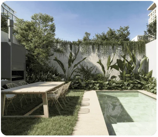 Patio con piscina y jardín, con mesa exterior de madera.